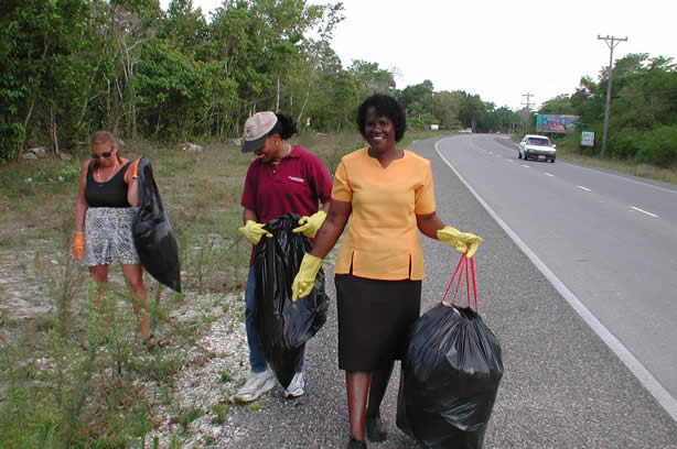 Volunteers Clean-Up Roadside Entrance to Negril - Negril Travel Guide