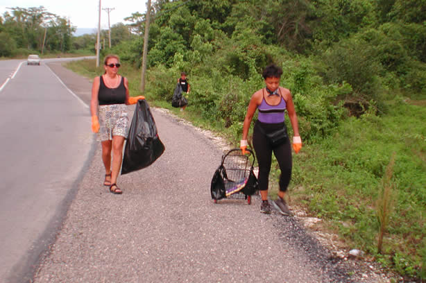 Volunteers Clean-Up Roadside Entrance to Negril - Negril Travel Guide